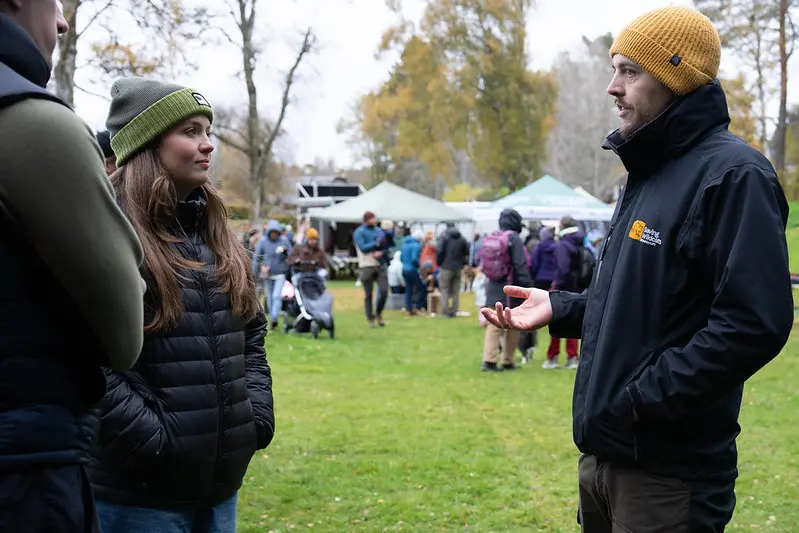 Cairngorms Connect partner Saving the Wild Cat staff talking to event attendees