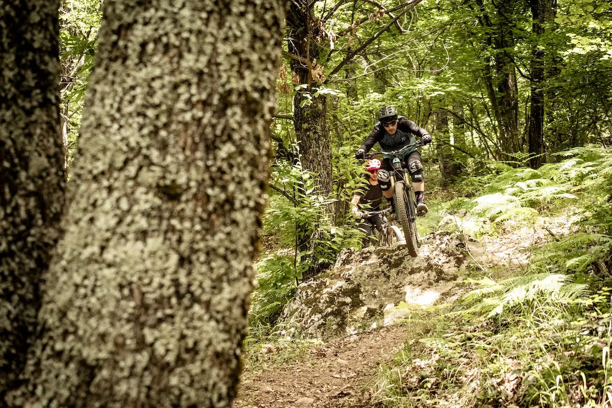 Mountain bikers riding through forest in Greece
