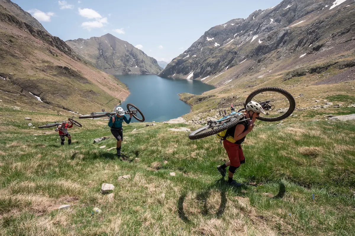Mountain bikers hiking their bikes in the Pyrenees