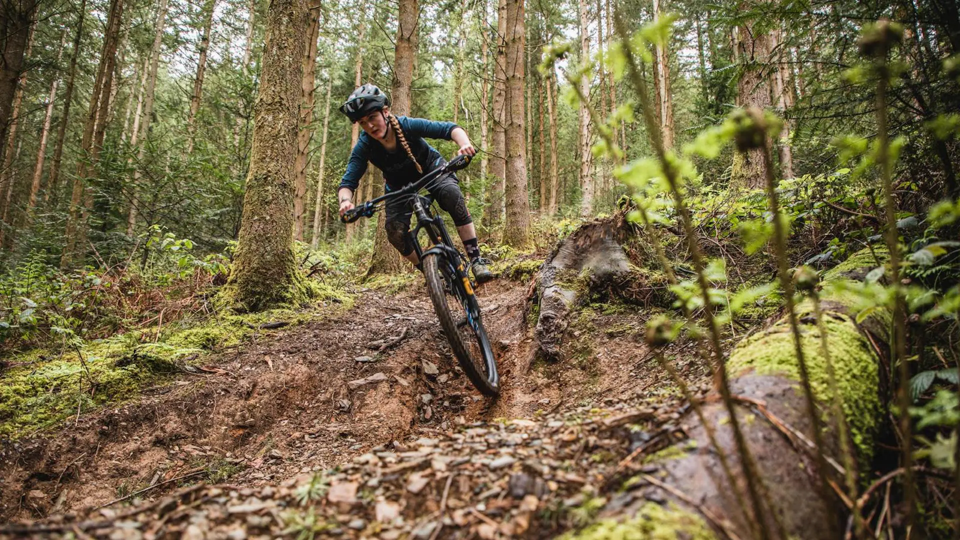 Local guide Hâf descending a mountain bike trail.