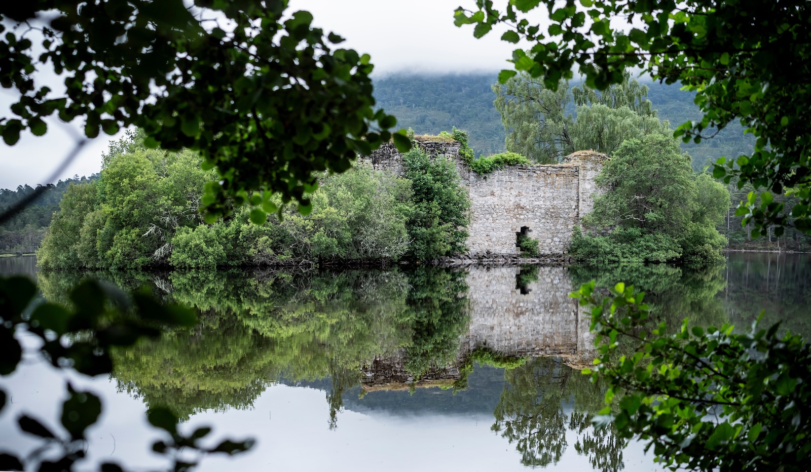 Ruined castle on Loch an Eilean, Cairngorms, Scotland