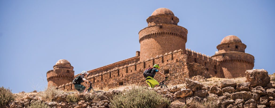 Climbing to an ancient palace on our E-MTB Tour Spain