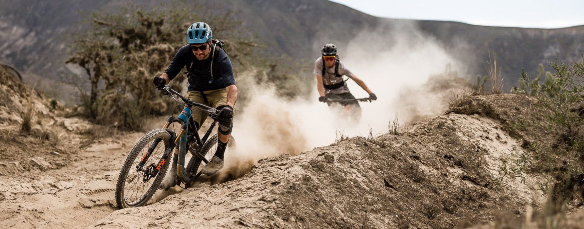 Kicking up dust on our mountain bike tour Ecuador