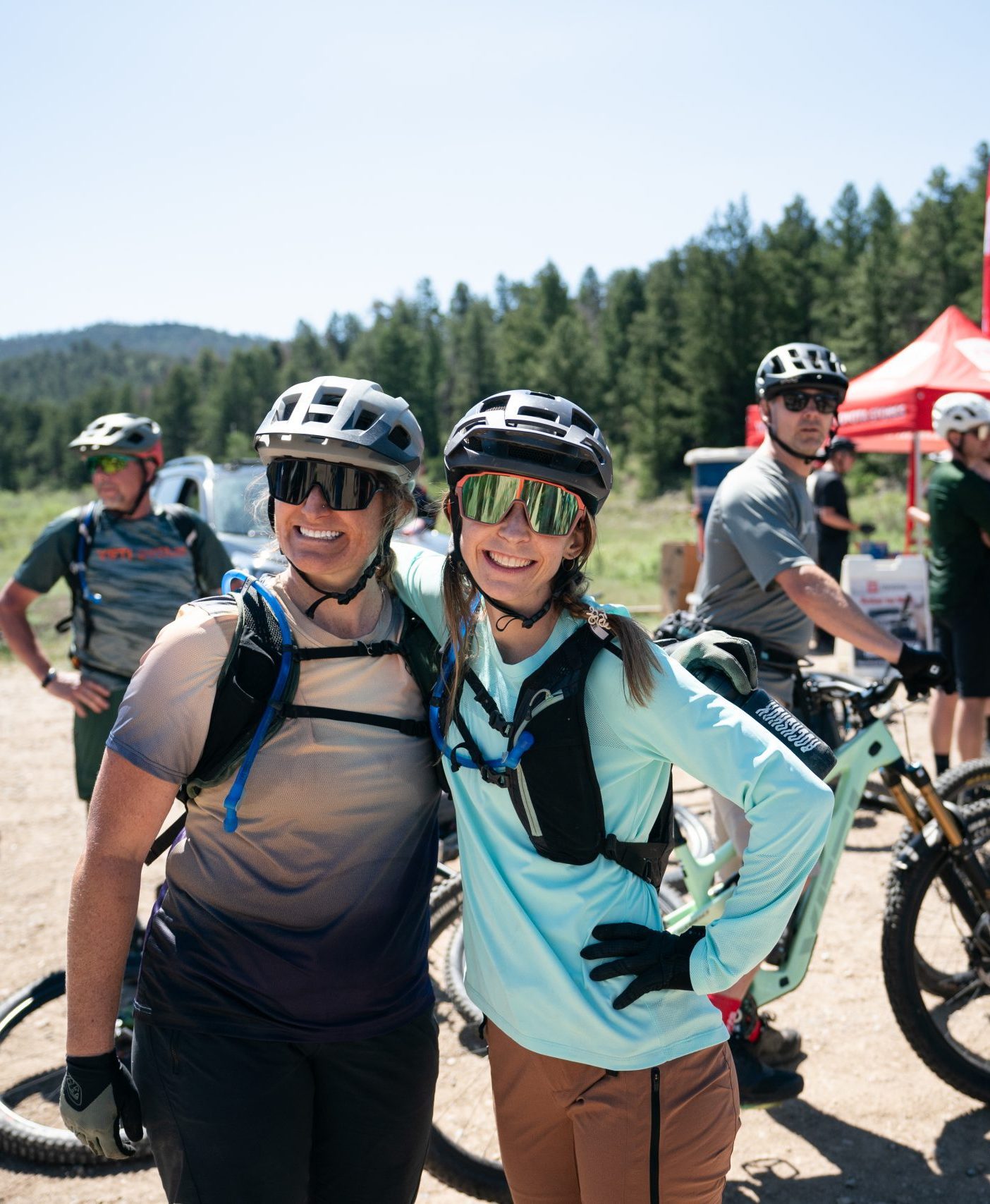 Female riders smiling at Yeti gathering
