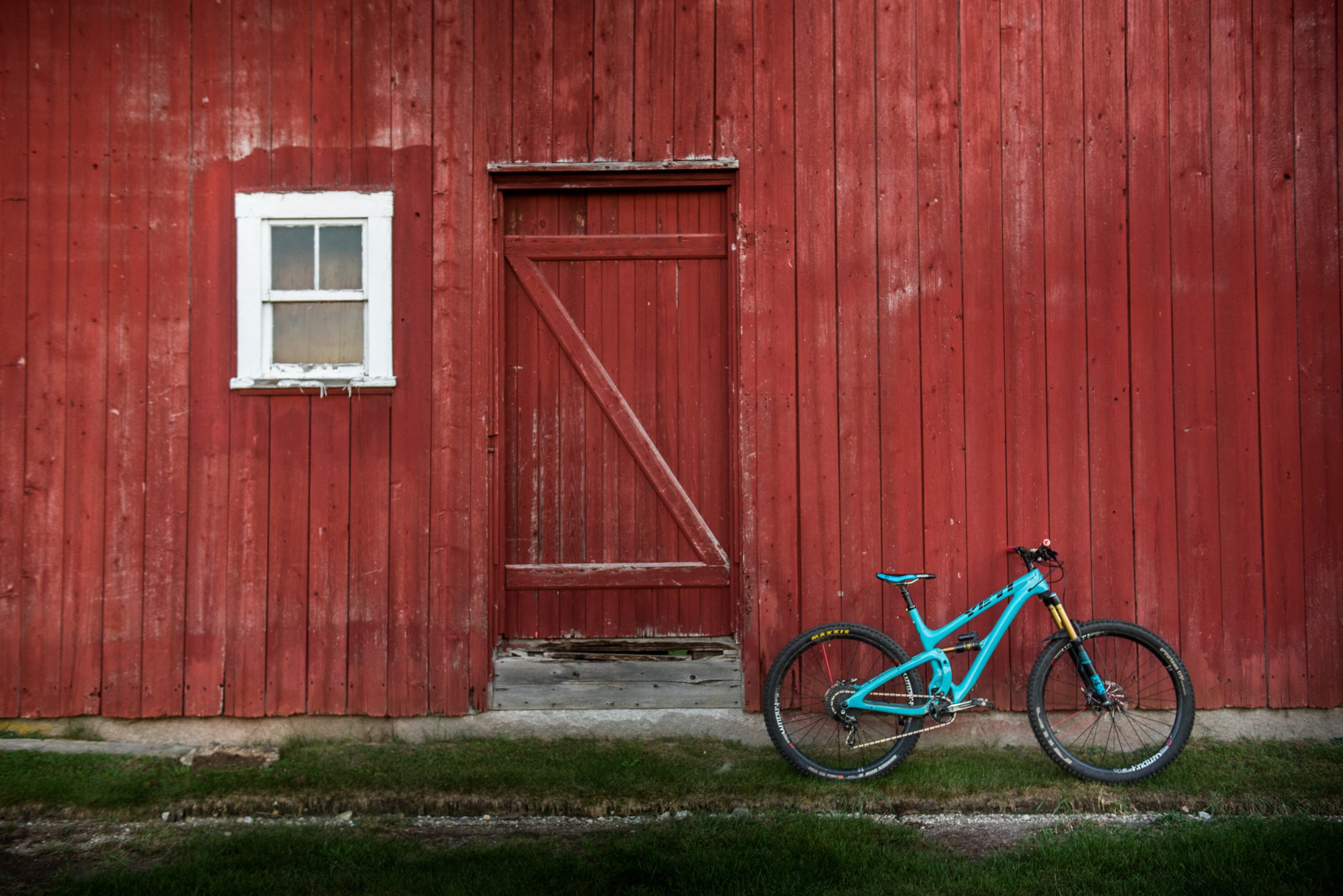 Yeti bike infront of red barn in Vermont