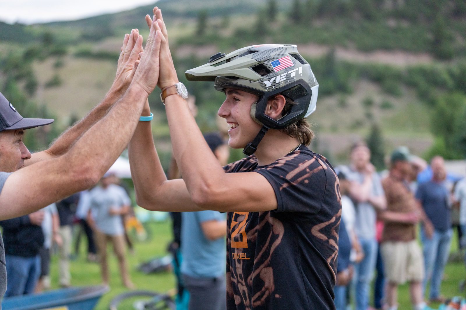 Young yeti rider high-fiving at Yeti Gathering Colorado