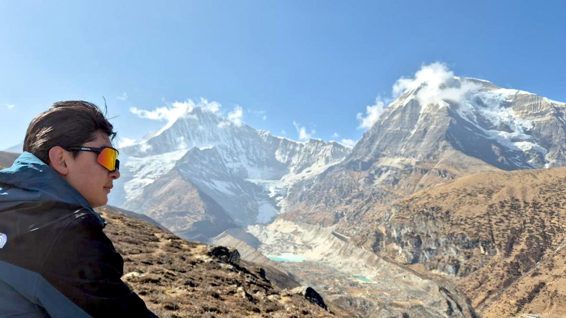 Local MTB guide in Bhutan, Pelden Wangchuk admiring the view of the mountains