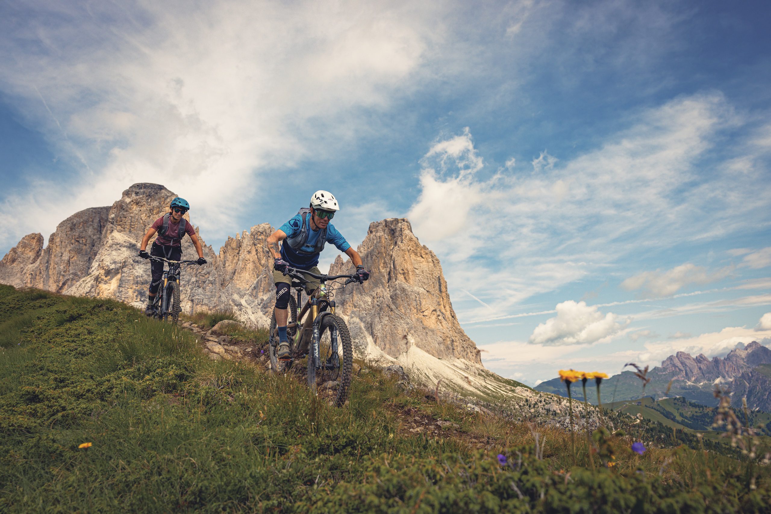 Male and female mountain bikers in the Dolomites